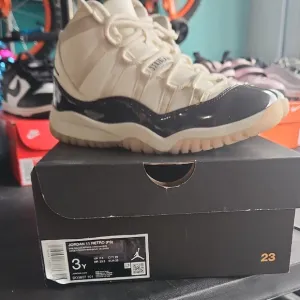 Jordan 11 Black and Cream Sneakers High-Top