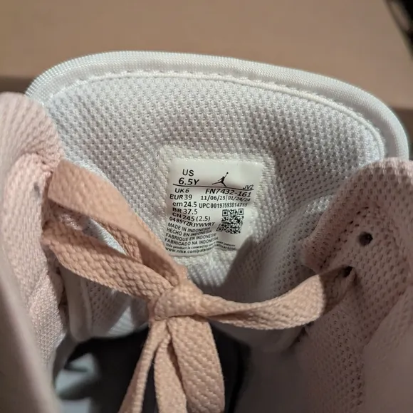 Jordan Pink and White Mid-Top Sneakers