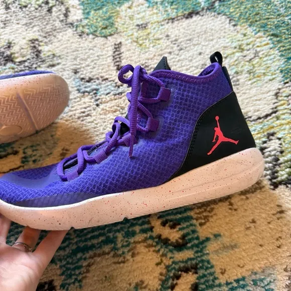 Purple high top NIKE Jordan Reveal basketball shoes