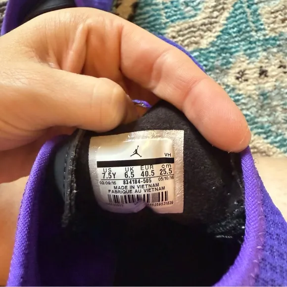 Purple high top NIKE Jordan Reveal basketball shoes