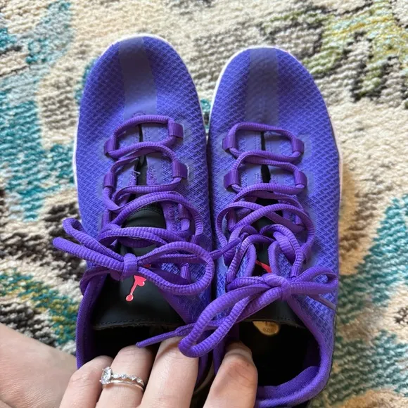 Purple high top NIKE Jordan Reveal basketball shoes
