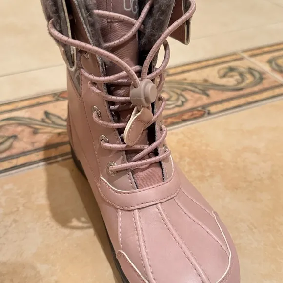 UGG Pink Winter Boots with Lace-Up Front and Sturdy Rubber Sole